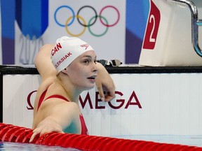 Penny Oleksiak has withdrawn from the world swimming championships because of injury. Oleksiak reacts following the women's 100m freestyle final during the Tokyo Summer Olympic Games, in Tokyo, Friday, July 30, 2021.