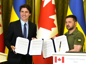 Prime Minister Justin Trudeau, left, and Ukrainian President Volodymyr Zelenskyy pose with joint declaration adopted by Canada and Ukraine during a press conference in Kyiv, Ukraine, Saturday, June 10, 2023.