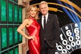 Wheel of Fortune's Vanna White and Pat Sajak.
