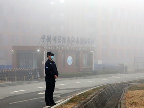 A man guards in front of Wuhan Institute of Virology in Wuhan City, Hubei Province, China on February 3, 2021.