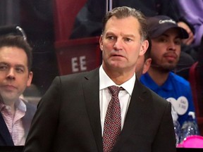 Kirk Muller works behind the bench during a National Hockey League game with the Canadiens in 2020.
