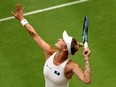 Marketa Vondrousova of Czech Republic serves against Elina Svitolina of Ukraine at Wimbledon.