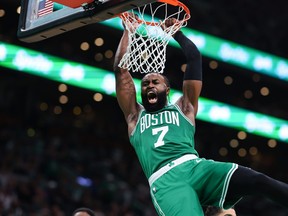Jaylen Brown of the Boston Celtics dunks the ball against the Miami Heat.