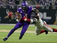 Minnesota Vikings' Dalvin Cook tries to get past New York Giants' Kayvon Thibodeaux.