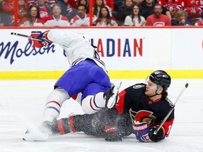 File photo/ Senators right wing Alex DeBrincat (12) gets tangled up with Montreal Canadiens defenseman Mike Matheson (8) during first period NHL action at the Canadian Tire Centre on Saturday, Jan. 28, 2023.