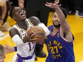 Los Angeles Lakers guard Dennis Schroder, left, the newest member of the Toronto Raptors, drives to the basket as Denver Nuggets guard Jamal Murray defends in the first half of Game 3 of their Western Conference final series on May 20, 2023, in Los Angeles.
