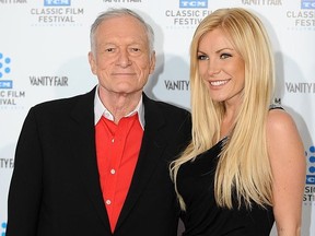 Playboy owner Hugh Hefner arrives with Playmate and actress Crystal Harris at the world premiere of the restored "A Star is born" during the opening Night Gala of the 2010 TCM Classic Film Festival in Hollywood, California, on April 23, 2010.