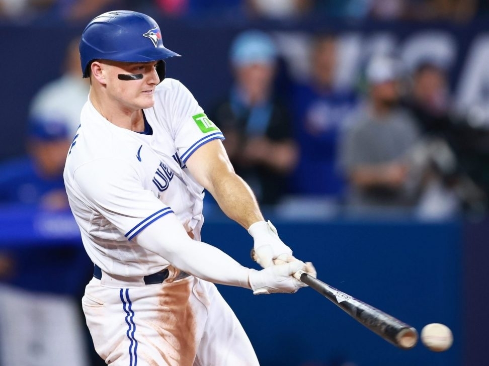 Toronto Blue Jays third baseman Matt Chapman high-fives left