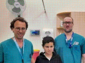 Drs. Ohad Einav and Ziv Asa with 12-year-old Suleiman Hassan (in middle) at Hadassah Medical Center following Hassan's recovery.