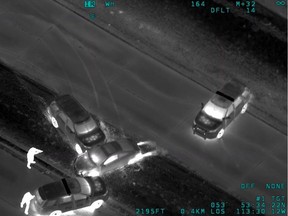 A still image taken from infrared video footage by EPS helicopter Air 1 of a Jan. 28, 2019, arrest that led to an investigation by ASIRT. The ASIRT decision draws attention to the heat, shown in white, of the rear wheels of the vehicle in the middle of the frame as evidence the suspect driver was stomping on the gas and trying to evade police.