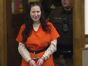 Taylor Schabusiness returns to a Brown County courtroom after attacking her attorney Quinn Jolly, during a hearing in Green Bay, Wis., Feb. 14, 2023.