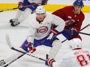 David Reinbacher (No. 36), the Canadiens’ first-round pick (fifth overall) at NHL Draft, battles for position during team’s development camp Sunday at the Bell Sports Complex in Brossard.