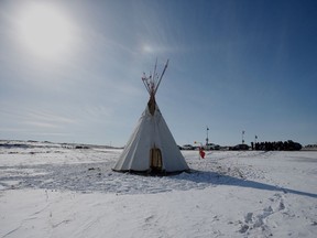 A teepee is shown as Christopher Traverse, Chief of Lake St. Martin First Nation speaks to the media at Winnipeg's Brady Landfill just outside the city, Thursday, April 6, 2023. The City of Winnipeg has ordered protesters who have been blocking access to a landfill in support of a search for the remains of two Indigenous women to leave.