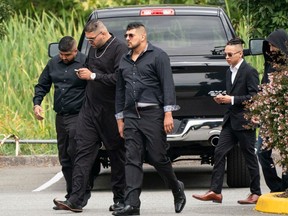 Friends of Hells Angels' Allie Grewal, a.k.a. Ali Grewal, attend his funeral service in Delta on Aug. 16, 2019. Harb Dhaliwal is in the middle, with arms straight down, and on the right, also wearing sunglasses, is accused killer Tyrel Nguyen Quesnelle.
