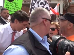 Prime Minister Justin Trudeau was mobbed by angry protesters in Belleville, Ont., and was forced to cut his visit to the local farmer's market short on Thursday, July 20, 2023.