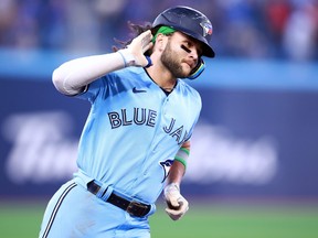 Bo Bichette of the Toronto Blue Jays rounds the bases after hitting a solo home run.