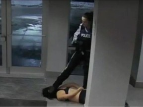 A still from a surveillance video showing Mona Wang on the ground and Kelowna RCMP Const. Lacy Browning.