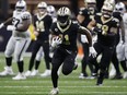 Alvin Kamara of the New Orleans Saints runs for a touchdown during a 2022 game.