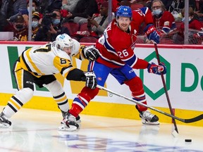 Canadiens defenceman Jeff Petry is pressured by Penguins superstar Sidney Crosby during a game in November 2021. After one year playing in Pittsburgh, Petry is returning to the fold after being acquired by Montreal on Sunday.