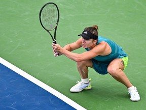 Elina Svitolina of Ukraine squats after returning the ball against Danielle Collins of the United States on Day 2 during the National Bank Open at Stade IGA on August 8, 2023 in Montreal.