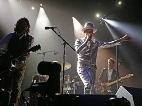 The late, great Gord Downie, centre, performs with The Tragically Hip in Edmonton in 2016. T