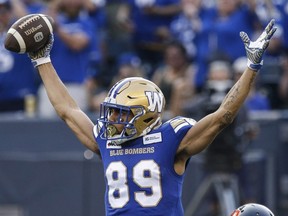 Winnipeg Blue Bombers receiver Kenny Lawler celebrates after scoring a first-half touchdown during a CFL game in Winnipeg on Aug. 3, 2023.