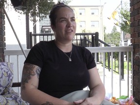 Meghan Duggan talks on the porch of her East York home on Thursday, Aug. 3, 2023, after a dog attack in her neighbourhood over the weekend.