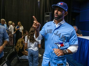 Jose Bautista gestures after addressing the media during a news conference at the Rogers Centre in Toronto on Friday Aug. 11, 2023. Bautista signed a one-day contract to officially retire as a member of the Toronto Blue Jays.