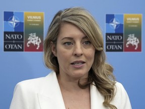 Foreign Affairs Minister Melanie Joly speaks with reporters at the NATO Summit in Vilnius, Lithuania, Tuesday, July 11, 2023. Joly says Canada has been considering a "game plan" for how it would respond if the United States takes a far-right, authoritarian shift after next year's presidential elections.