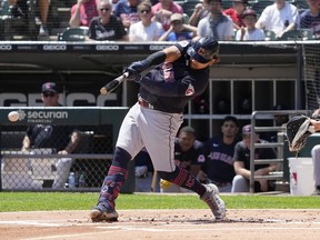Cleveland Guardians' Josh Naylor hits a single during the first inning of a baseball game against the Chicago White Sox in Chicago, Sunday, July 30, 2023.