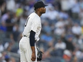 New York Yankees starting pitcher Domingo German reacts to a home run Tuesday, July 25, 2023, in New York.
