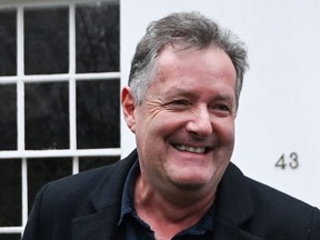 Journalist and television presenter Piers Morgan smiles as he steps out of his house, after he left his high-profile breakfast slot with the broadcaster ITV, following his long-running criticism of Prince Harry's wife, Meghan, in London, Britain, March 10, 2021.