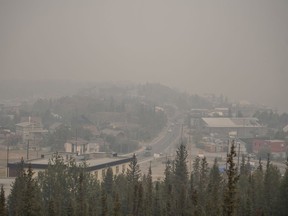 Heavy smoke from nearby wildfires fills the sky in Yellowknife on Tuesday, August 15, 2023.