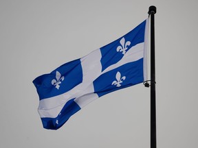 The Quebec flag flies on top of the legislature in Quebec City, Wednesday, Jan. 18, 2023.