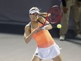 Canada's Eugenie Bouchard hits a return to Sara Sorribes Tormo, of Spain, during the women's final in the Abierto of Zapopan tennis tournament in Zapopan, Mexico, Saturday, March 13, 2021. Bouchard is out of the Firenze Ladies Open after she retired from her quarterfinal match against Italy's Sara Errani.