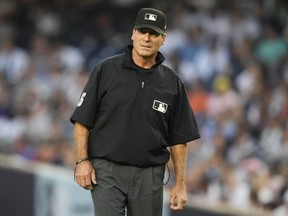 FILE - Umpire Ángel Hernández during the first inning of a baseball game between the New York Yankees and the Houston Astros, Friday, Aug. 4, 2023, in New York. Hernández lost again in his race discrimination lawsuit against Major League Baseball when a federal appeals court refused to reinstate his case on Tuesday, Aug. 15, 2023.
