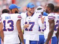 Josh Allen (centre) of the Buffalo Bills laughs with Gabe Davis and Latavius Murray.