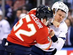 Florida Panthers defenceman MacKenzie Weegar fights Toronto Maple Leafs' Kasperi Kapanen during a game in 2020.