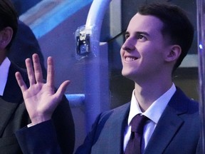 Toronto Maple Leafs' 2020 first round draft pick Rodion Amirov waves as he is acknowledged by the crowd during a pre-game ceremony.