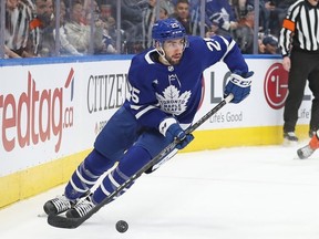 Conor Timmins #25 of the Toronto Maple Leafs skates with the puck against the Anaheim Ducks at Scotiabank Arena on December 13, 2022 in Toronto, Ontario, Canada.