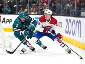 Canadiens Rafael Harvey-Pinard controls the puck against Sharks defenceman Matt Benning during a game at the SAP Center in February.