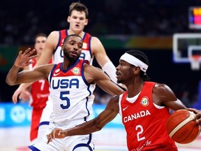 Shai Gilgeous-Alexander #2 of Canada drives against Mikal Bridges #5 of the United States in the second quarter during the FIBA Basketball World Cup 3rd Place game at Mall of Asia Arena on September 10, 2023 in Manila, Philippines.