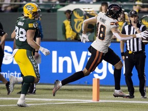 The Edmonton Elks' Adam Konar (38) looks on as the B.C. Lions' Justin McInnis (18) scores a touchdown during first half CFL action at Commonwealth Stadium, in Edmonton Friday Sept. 22, 2023.