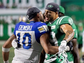 Winnipeg Blue Bombers receiver Nic Demski, left, gets into the face of a Saskatchewan Roughrider in their heated game on Sept. 5.