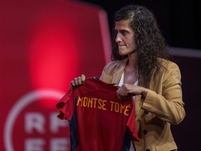 Spain's new women's national team coach Montse Tome, holds a jersey during her official presentation at the Spanish soccer federation headquarters in Las Rozas, just outside of Madrid, Spain, Monday, Sept. 18, 2023. Tome replaced Jorge Vilda less than three weeks after Spain won the Women's World Cup title and amid the controversy involving suspended federation president Luis Rubiales who has now resigned.
