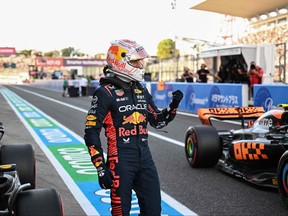 Red Bull Racing's Dutch driver Max Verstappen celebrates after taking poll position in the qualifying session for the Formula One Japanese Grand Prix at the Suzuka circuit, Mie prefecture on Sept. 23, 2023.