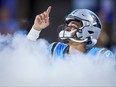 Carolina Panthers quarterback Bryce Young points to the sky as he takes the field prior to an NFL preseason football game against the Detroit Lions, Friday, Aug. 25, 2023, in Charlotte, N.C.