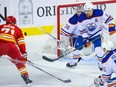 Calgary Flames forward Walker Duehr watches a rebounding puck in front of Edmonton Oilers goaltender Jack Campbell and defenceman Cody Ceci during preseason NHL action at the Scotiabank Saddledome in Calgary on Friday, September 29, 2023. Gavin Young/Postmedia