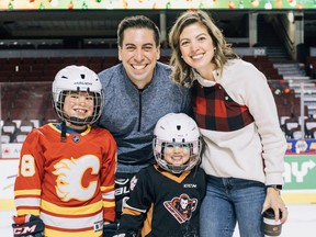 Flames assistant general manager Chris Snow, wife Kelsie and their children, son Cohen and daughter Willa.