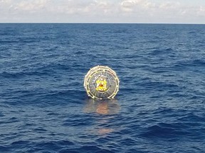 This October 4, 2014 US Coast Guard handout photo a man aboard an inflatable hydro bubble who needed assistance.